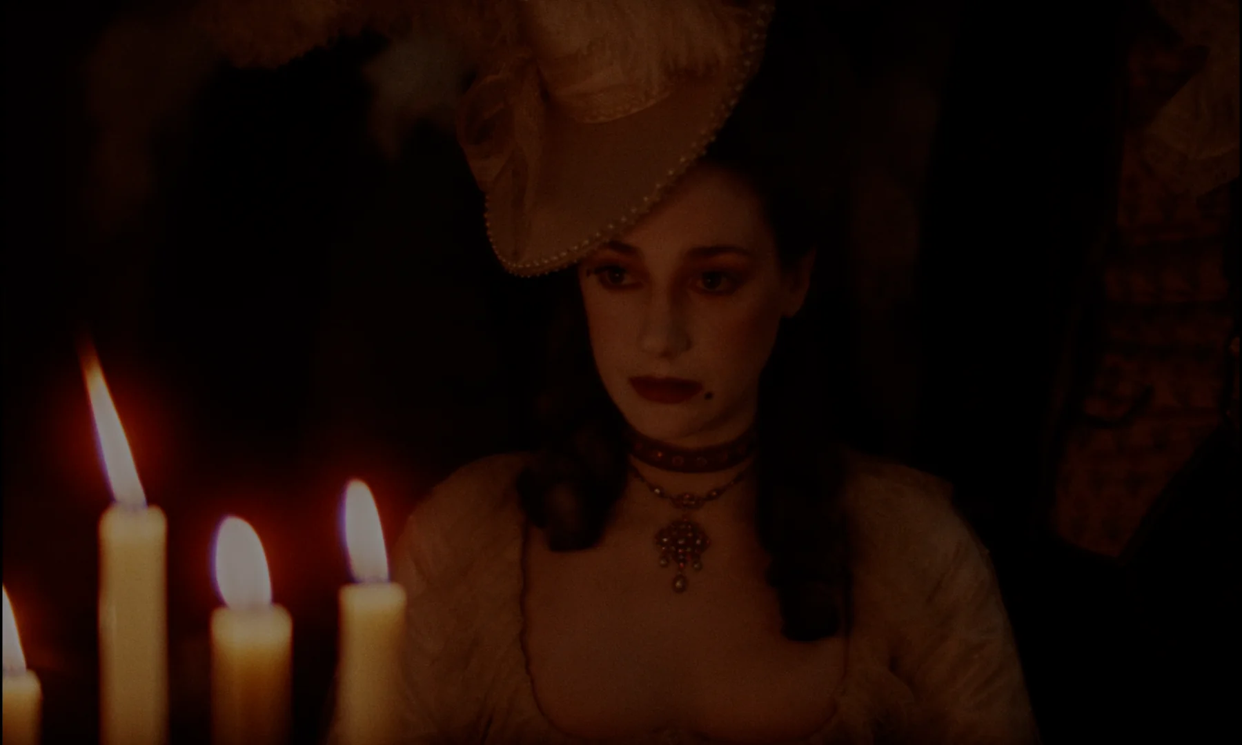 A face lit by a single held candle flame - (Barry Lyndon, 1975)