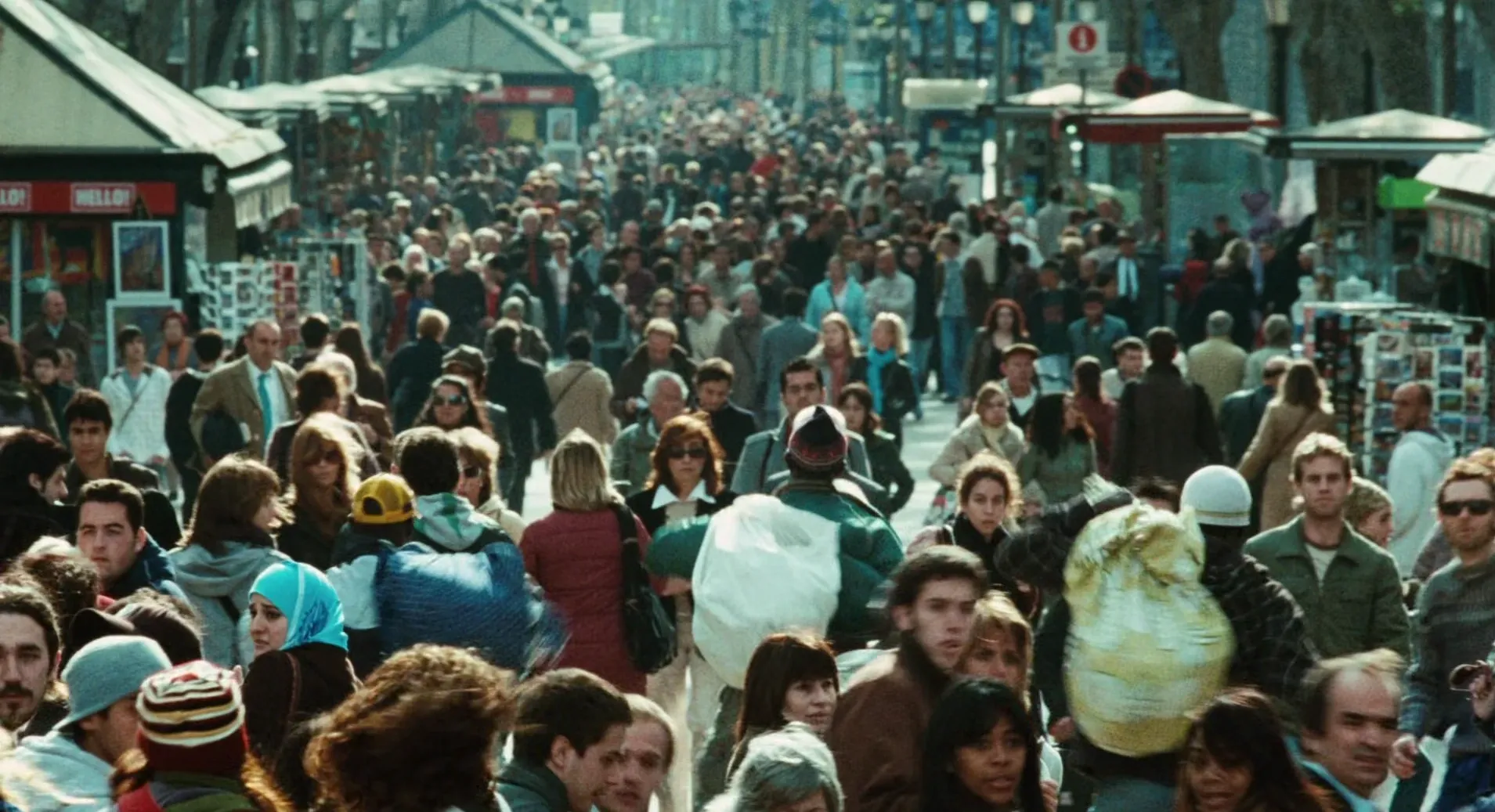 Biutiful (2010) — "a busy street" is a real number: every one of these background performers is a body you cast, dress, and pay