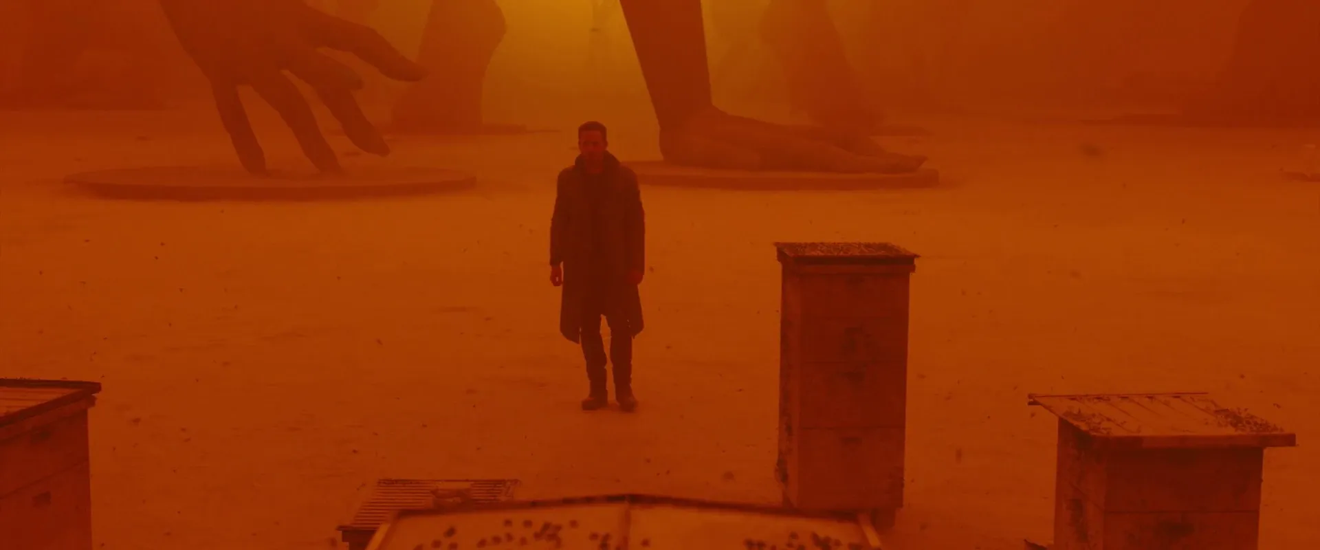Blade Runner 2049 (2017) β K crosses the orange dust of ruined Las Vegas toward the fallen monuments