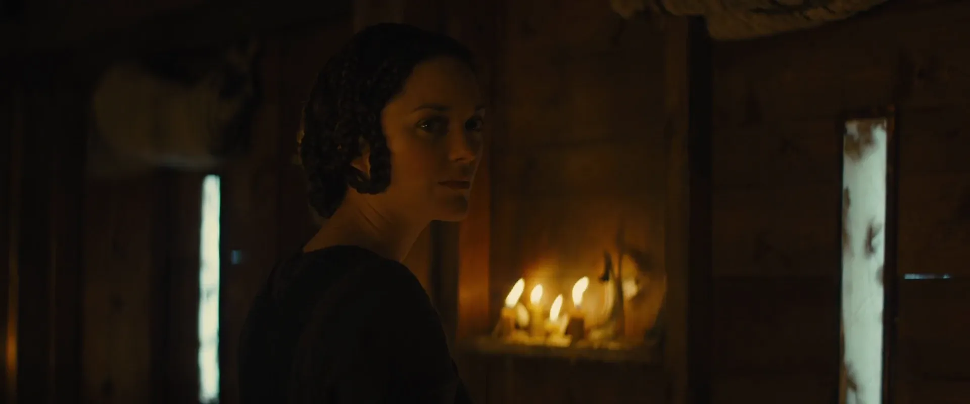 Practical candles left in the frame, doing the lighting themselves — Macbeth (2015)