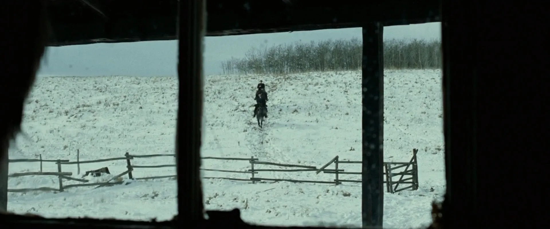 The Assassination of Jesse James by the Coward Robert Ford (2007) — a lone rider reduced to a speck in a snowbound field