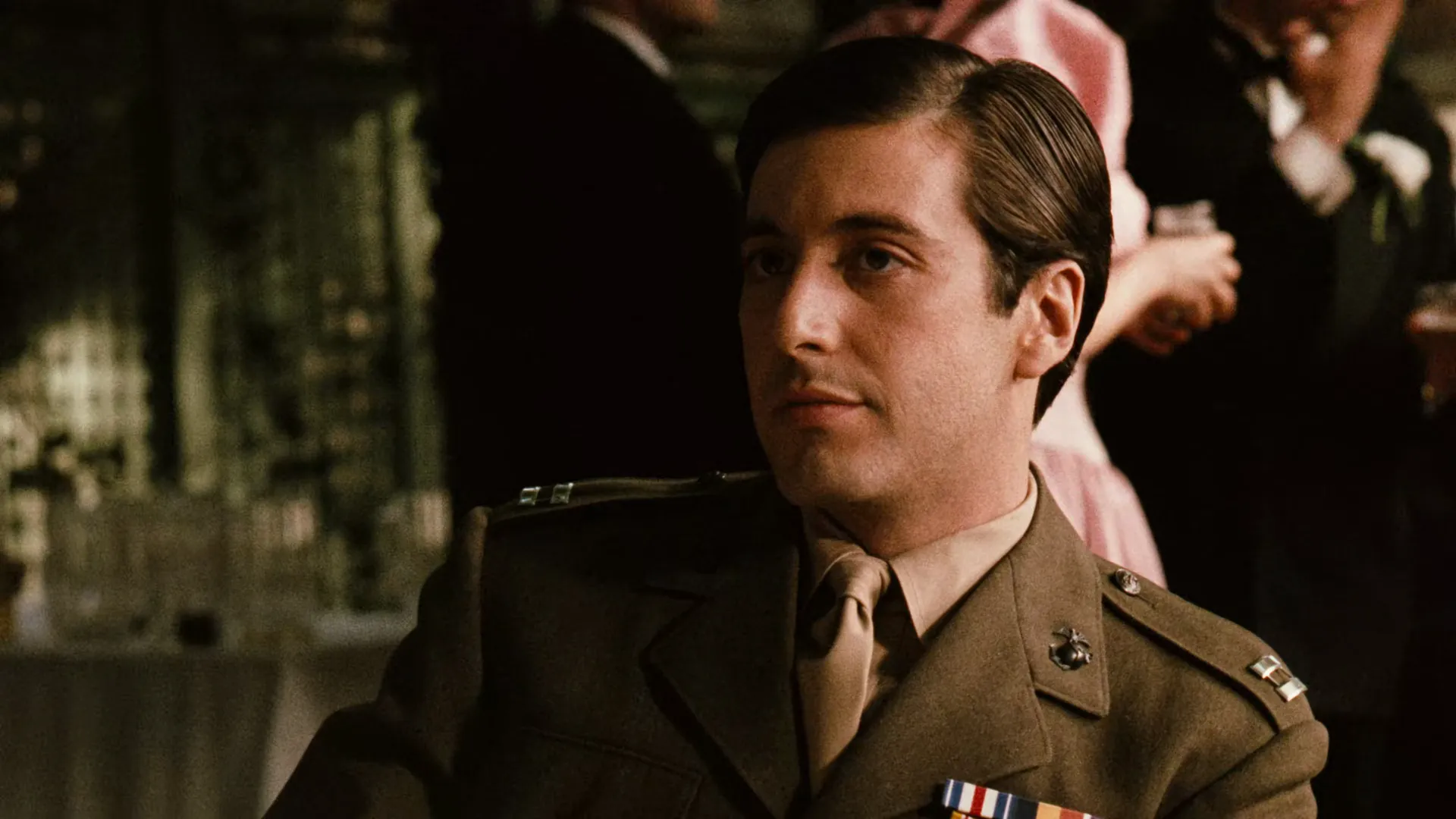 The Godfather (1972) — Michael Corleone early in the film, lit openly before his descent