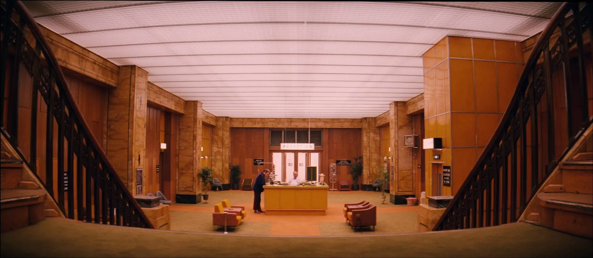 Symmetrical Art Deco hotel lobby in The Grand Budapest Hotel (2014), where each timeline gets its own aspect ratio