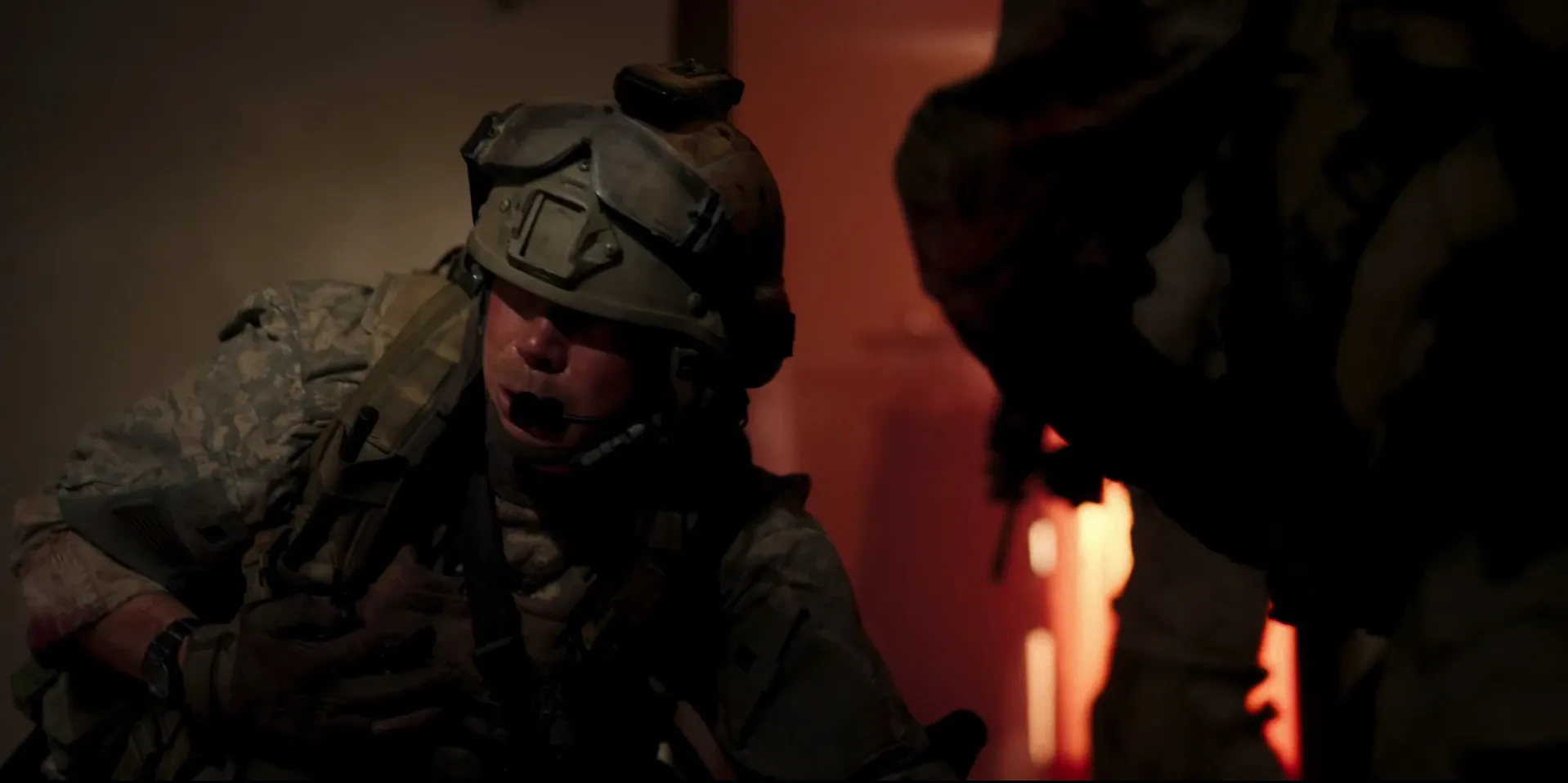 A soldier braced in the firelit dark of a real-time combat sequence, Warfare (2025)