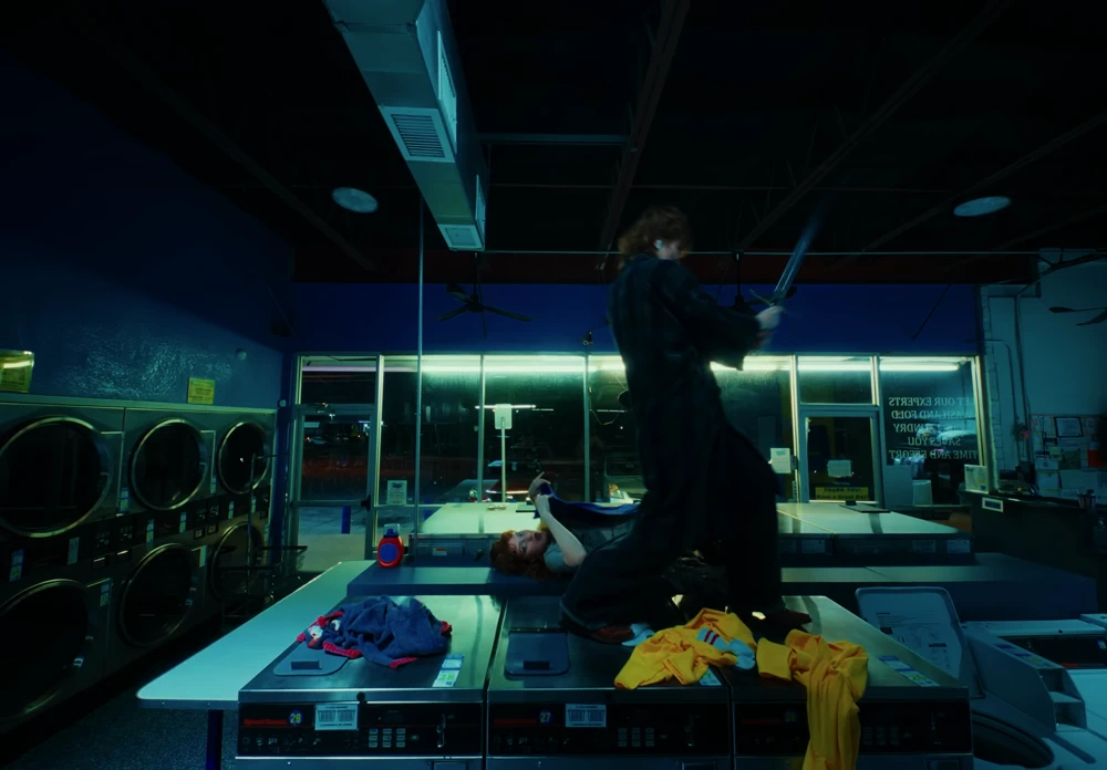 Still frame 23 from Die Spitz - Throw Yourself to the Sword (2025) directed by Emily Sanchez