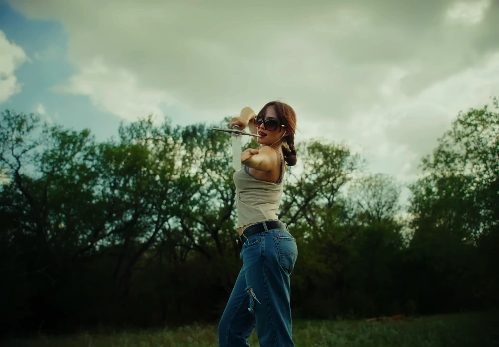 Still frame 43 from Die Spitz - Throw Yourself to the Sword (2025) directed by Emily Sanchez
